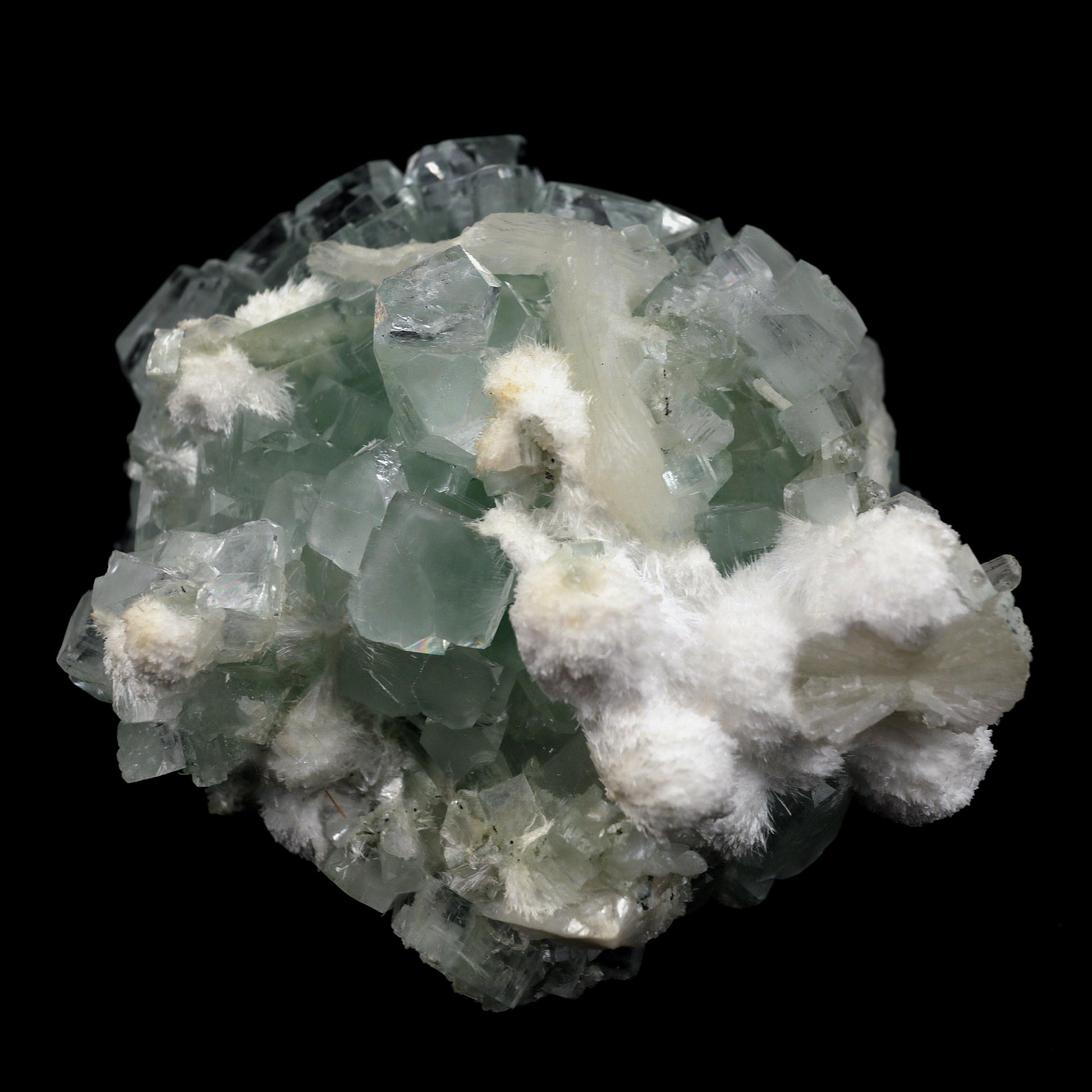 Green Apophyllite Disco Ball with Stilbite, Mordenite Natural Mineral …  https://www.superbminerals.us/products/green-apophyllite-disco-ball-with-stilbite-mordenite-natural-mineral-specimen-b-4389  Features:Stunning clusters of glassy, gemmy, bi-colored, tetragonal apophyllite crystals are artistically centered on creamy stilbite crystals & Mordenite on this outstanding large specimen from Ahmadnagar. The crystals have rich mint-green bodies and limpid colorless terminations. The fantastic "disco ball" 