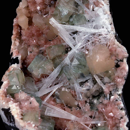 Green Apophyllite with Scolecite Sprays on Stilbite Natural Mineral Sp…  https://www.superbminerals.us/products/green-apophyllite-with-scolecite-sprays-on-stilbite-natural-mineral-specimen-b-4643  Features: A striking, big, and sculptural 3-dimensional matrix combination material from the state of Maharashtra. The item is dominated by two-toned, mint-green and off-white, glossy, transparent, blocky tetragonal apophyllite crystals with satin lustre faces. Clusters of snow-white acicular scolecite crystals