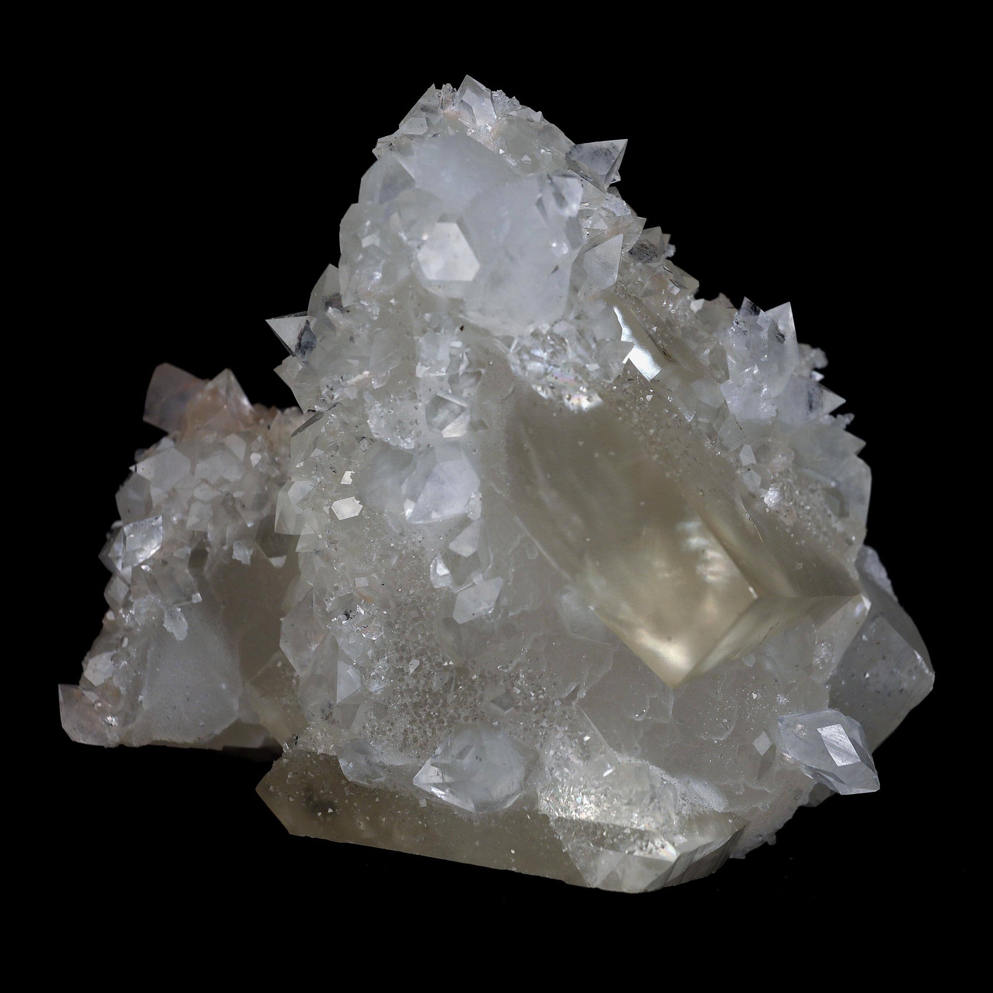 Pseudo Calcite with Apophyllite Natural Mineral Specimen # B 4632  https://www.superbminerals.us/products/pseudo-calcite-with-apophyllite-natural-mineral-specimen-b-4632  Features: Truly exceptional combination piece with with one of the finest Indian Calcites, lustrous Apophyllite. The centerpiece Calcite is a stunning on the front edge, with superb luster and excellent gemminess. The front edge is also the main twinning plane. What makes the Calcite itself even more exceptional 